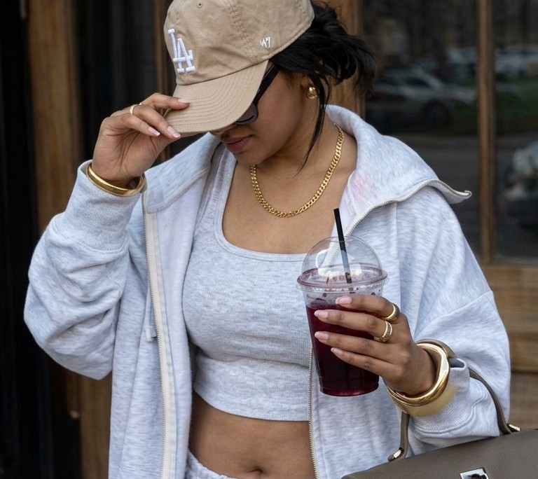 Woman on the go with a drink, supporting her body while on a weight loss shot